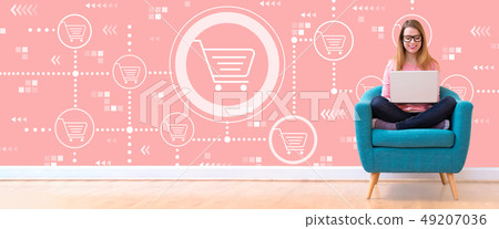 Online shopping theme with woman using a laptop 49207036