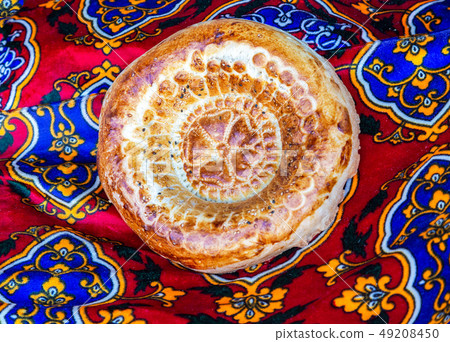 Traditional uzbek flatbread with sesame seeds 49208450