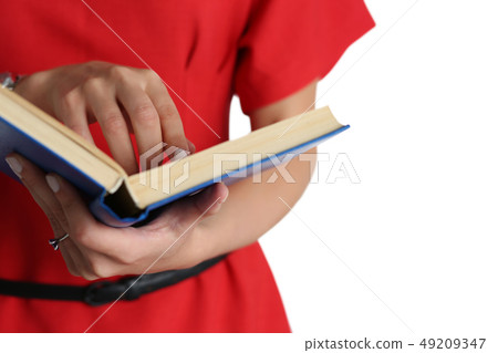 Female hands holding textbook closeup Female hands holding textbook closeup 49209347