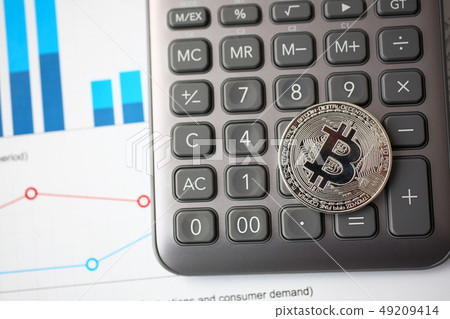 Silver btc sign coin lying at stats graph closeup 49209414