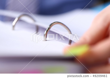 File binder fastener with pile of papers clipped inside 49209461