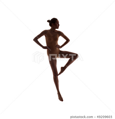 young beautiful dancer in beige swimsuit posing young beautiful dancer in beige swimsuit posing 49209603