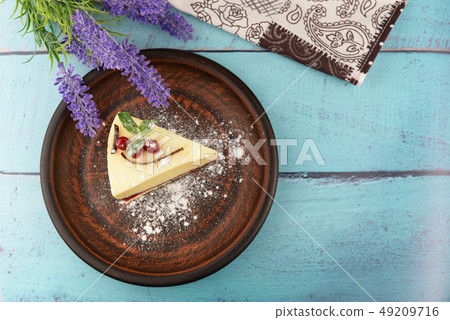 dessert cheesecake with mint and berries  49209716
