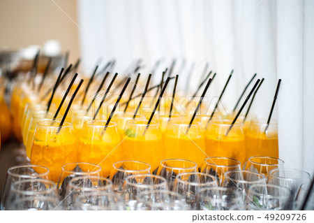 Many glasses of mulled wine and various alcoholic beverages 49209726