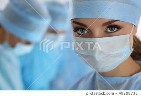 Female surgeon portrait looking in camera Female surgeon portrait looking in camera 49209733