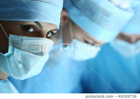 Female surgeon portrait looking in camera Female surgeon portrait looking in camera 49209736