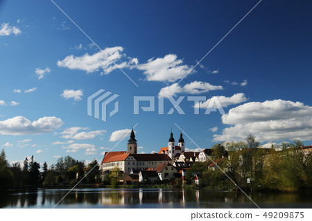 Czech Telc landscape with blue sky, clouds and church Czech Telc landscape with blue sky, clouds and church 49209875