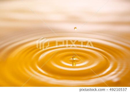 Yellow water drops and ripples Yellow water drops and ripples 49210537