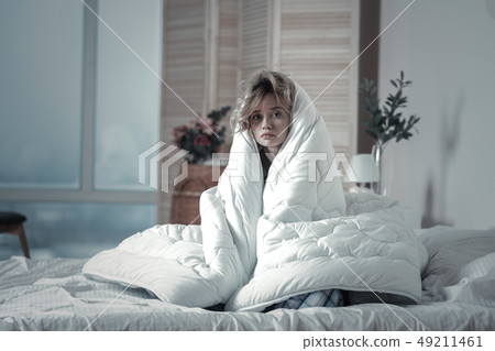 Depressed woman feeling unmotivated in the morning Depressed woman feeling unmotivated in the morning 49211461