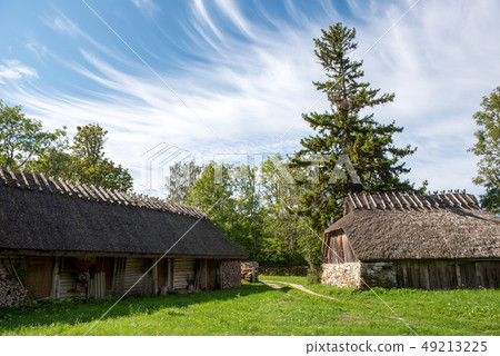 Old barns with thatched roof in Estonia 49213225