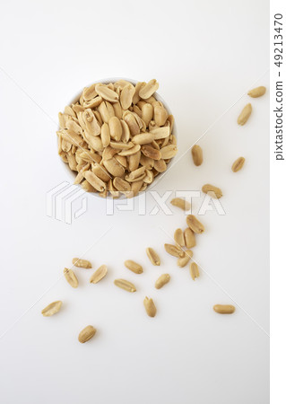 Roasted peanuts and salt in a bowl Roasted peanuts and salt in a bowl 49213470