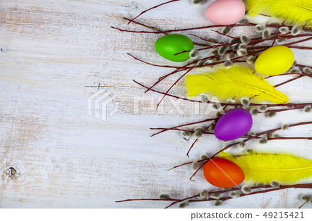 Easter still life with Easter eggs and willow. Easter still life with Easter eggs and willow. 49215421