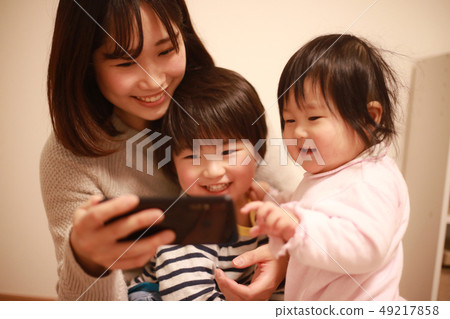 Parent and child using smartphone Parent and child using smartphone 49217858