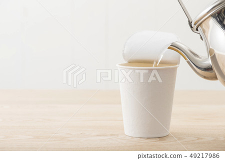 Pour hot water into cup noodles Pour hot water into cup noodles 49217986