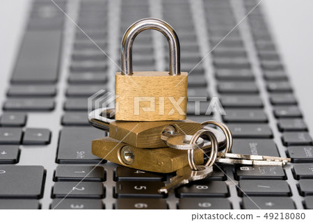 Three golden padlocks on the keyboard Three golden padlocks on the keyboard 49218080