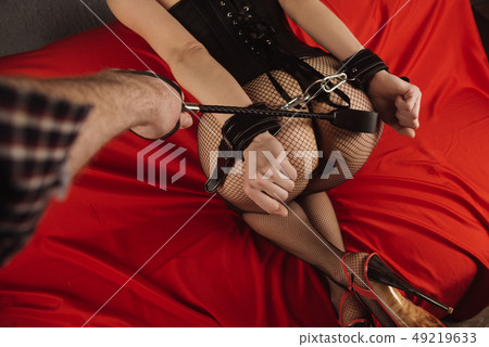 Adult sex games. Submissive girl in bondage  49219633