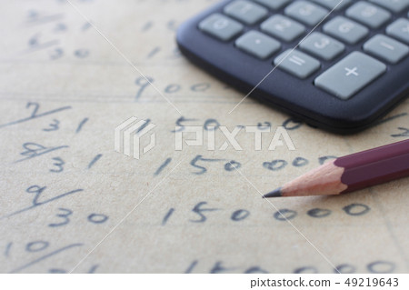 Model written on paper with paper, pencil, calculator and house 49219643