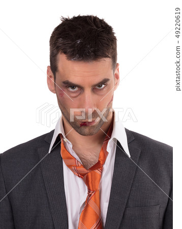 Close up of a businessman with bloody lip, beaten Close up of a businessman with bloody lip, beaten 49220619