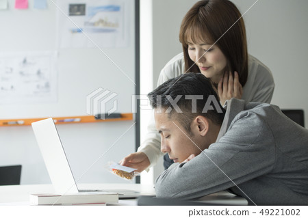 Co-worker office work tired snoozing 49221002