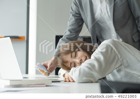 Co-worker office work tired snoozing 49221003