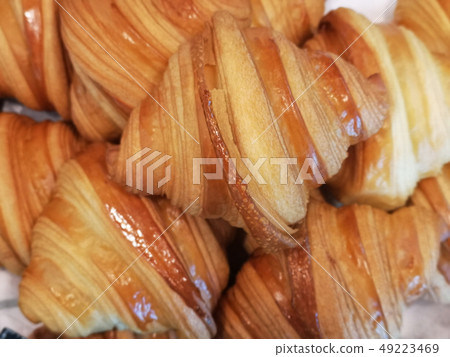 close up of freshly baked crusty croissant  49223469