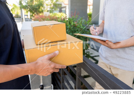 delivery service concept, customer hand receiving 49223885