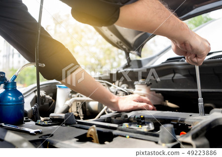 checking vehicle engine at the garage industrial checking vehicle engine at the garage industrial 49223886