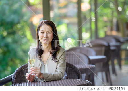 Middle senior woman restaurant wine travel image 49224164