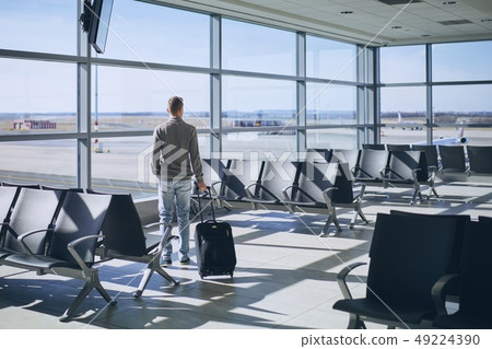 Traveler in airport terminal 49224390