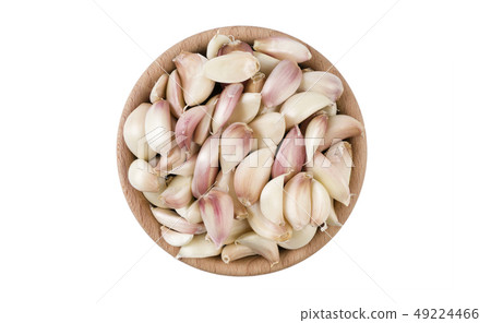 garlic cloves in wooden bowl isolated on white 49224466