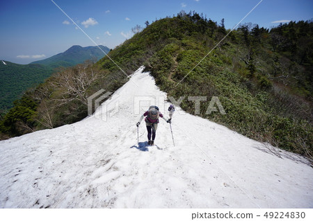 Mountain climber climbing high Tsumayama with snow 49224830