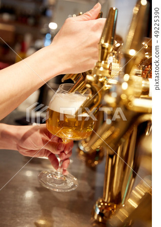 Beer poured from server 49225390