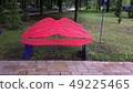 Bench for lips-shaped kisses in a city park. Red 49225465