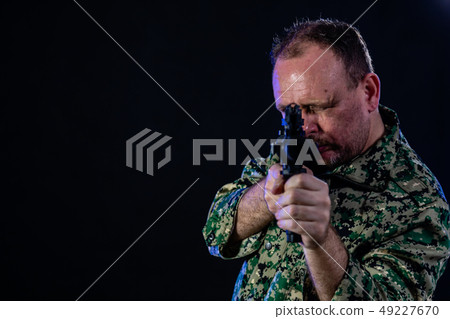 Soldier holding assault rifle 49227670