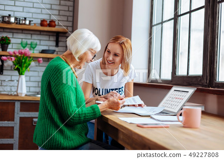 Retired woman checking the loan payment date on laptop calendar 49227808