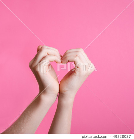 hands in the shape of a heart 49228027