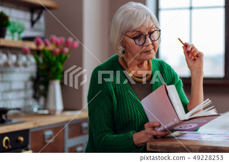 Face portrait of female being ready to make book notes 49228253