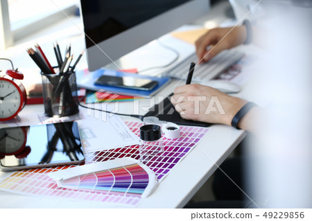 Test print paper page with colour test design fantail and magnifying glass 49229856