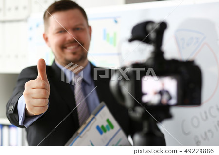 Male in suit and tie show confirm sign Male in suit and tie show confirm sign 49229886