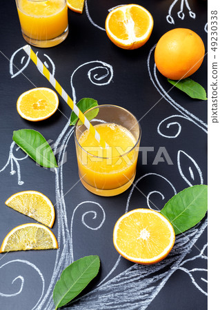 Glass of orange juice on dark background with 49230338