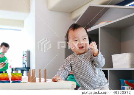 A boy playing a figure-matching game 49230872