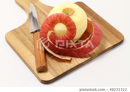 Fruits, peeled apple, peeled left hand Fruits, peeled apple, peeled left hand 49231322