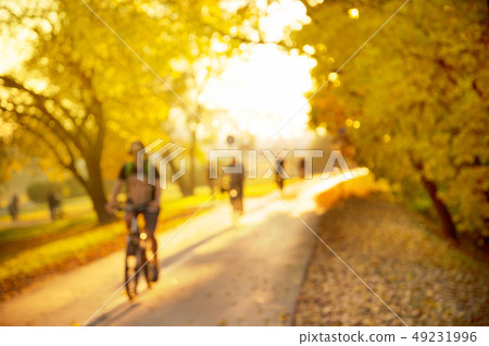 blur of biking people on the country side road blur of biking people on the country side road 49231996