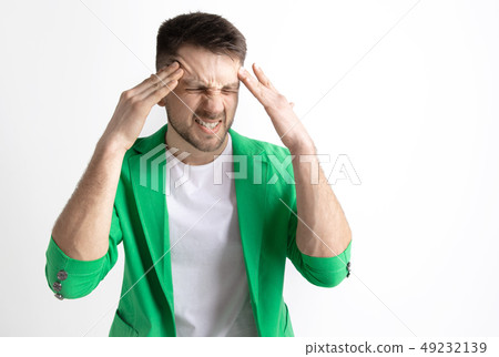Man having headache. Isolated over gray background. Man having headache. Isolated over gray background. 49232139