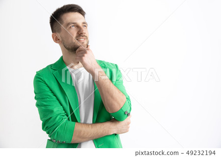 Young dreaming man isolated on white background looking at something Young dreaming man isolated on white background looking at something 49232194