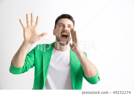 Young casual man shouting. Shout. Young casual man shouting. Shout. 49232274