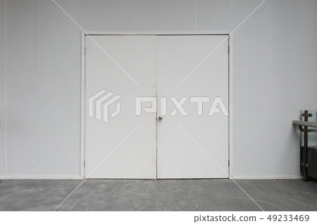 sidewalk by street wall & door sidewalk by street wall & door 49233469