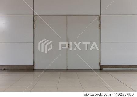 sidewalk by street wall & door sidewalk by street wall & door 49233499