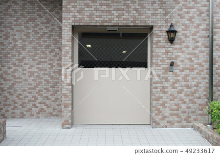 sidewalk by street wall & door sidewalk by street wall & door 49233617