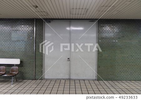 sidewalk by street wall & door sidewalk by street wall & door 49233633